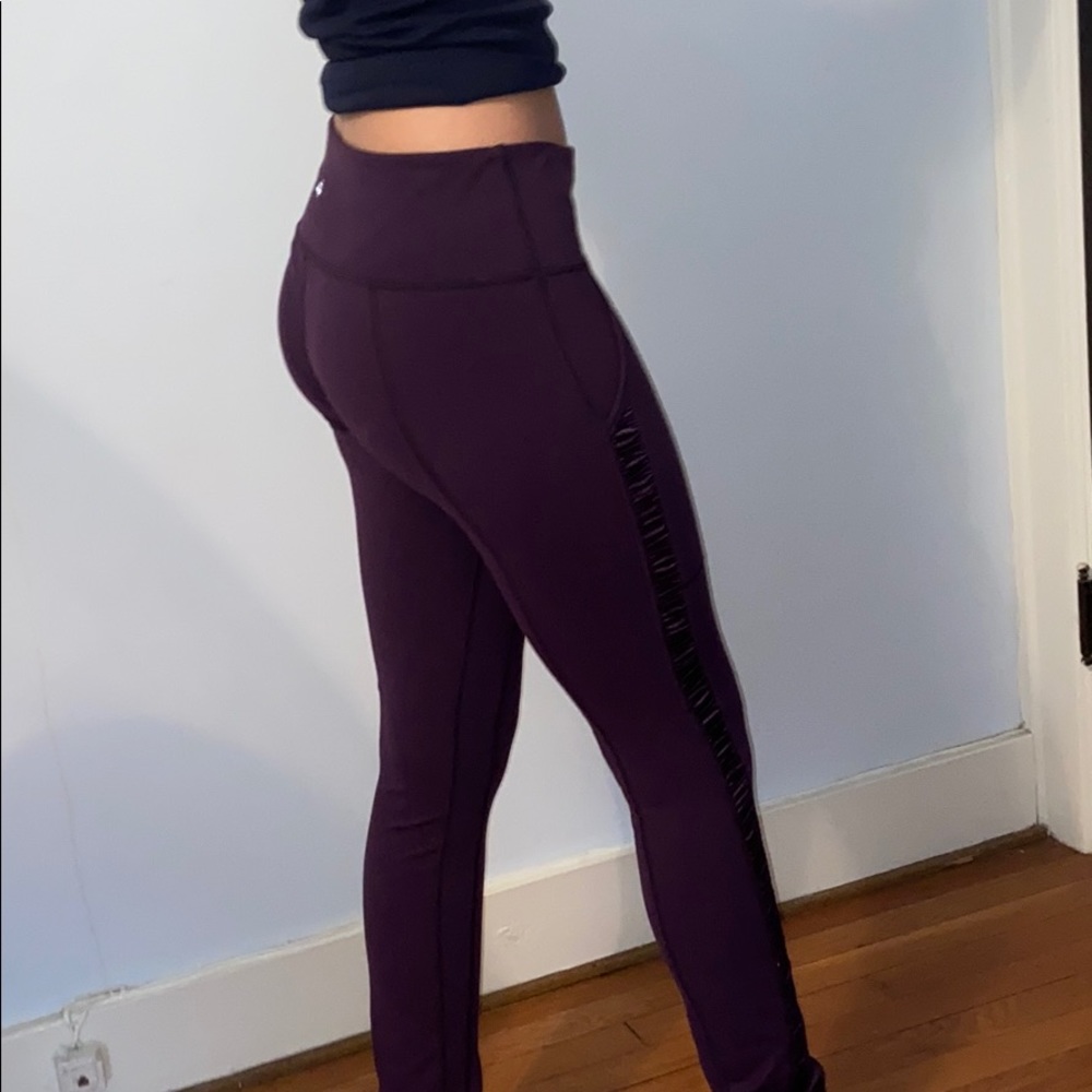 Purple Lululemon leggings with ruffles on the side